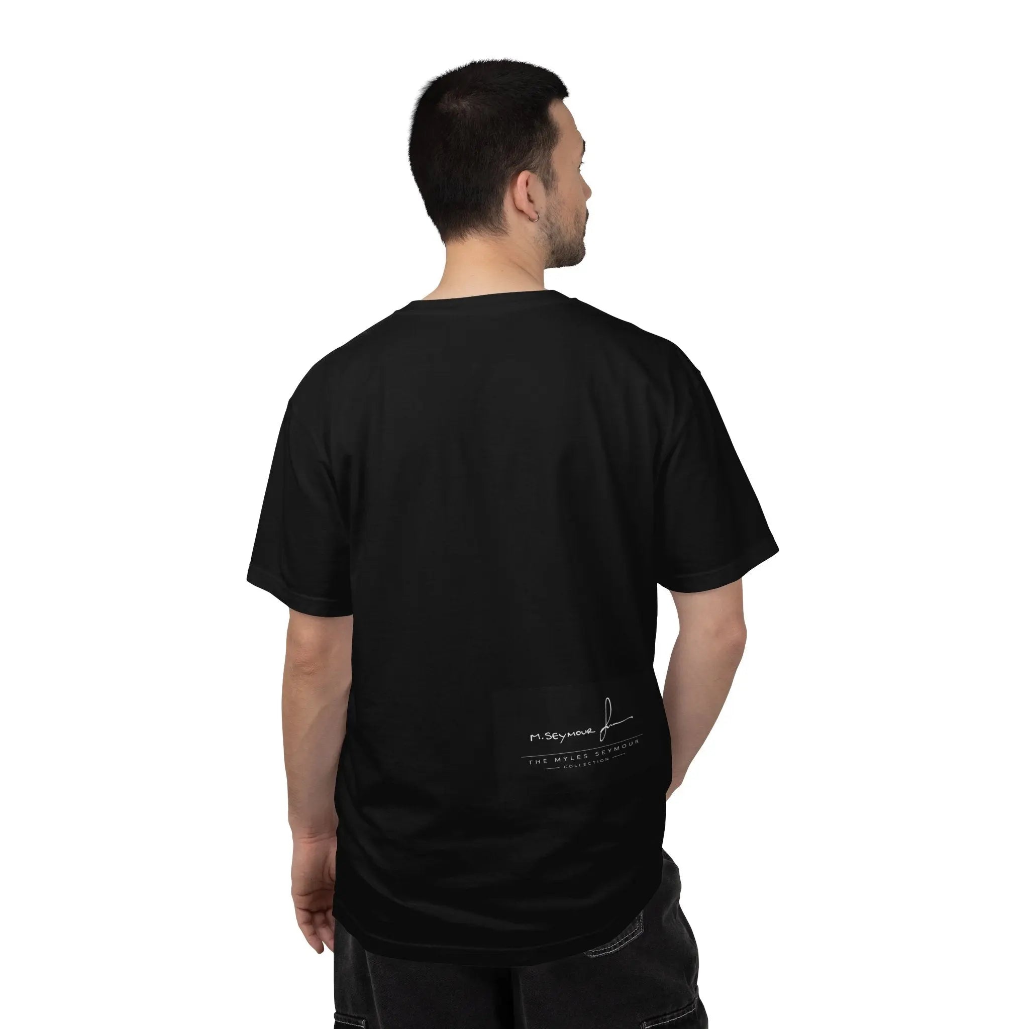 Man wearing a navy blue t-shirt on a white background with the Logog - The Myles Seymour collection 